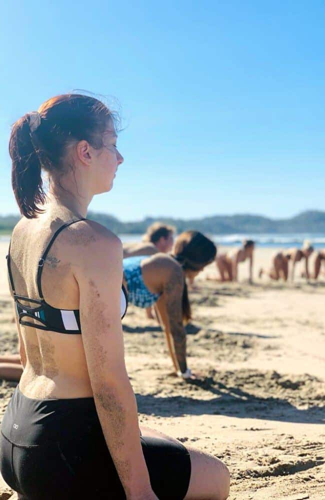 Connecting to the ocean with vinyasa Yoga flow on the beach