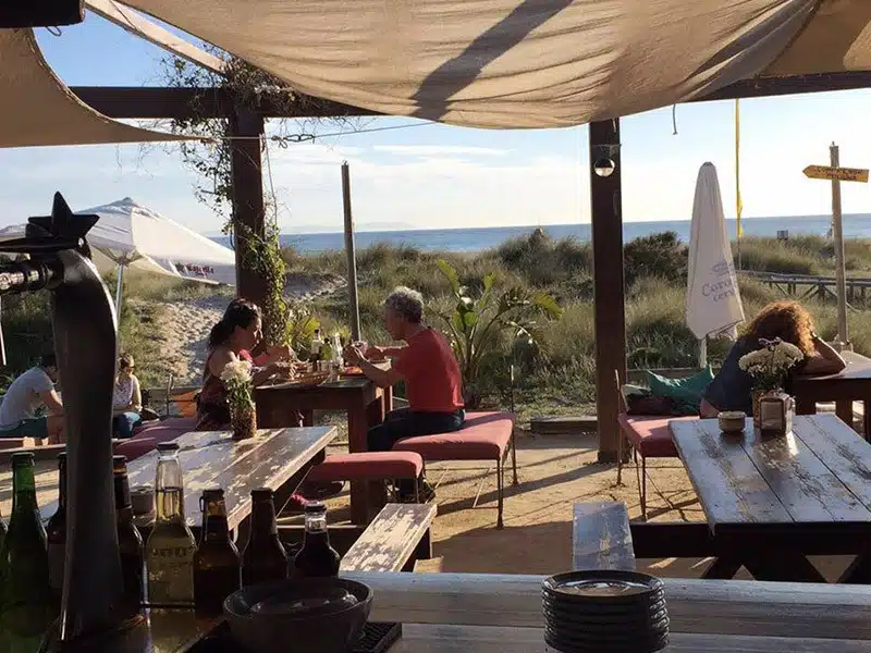 Waves beach bar in Tarifa, located in los lances with sofa and table to eat and chill