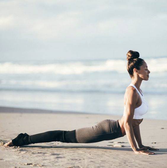 Sun Salutations to warm up your boday before kitesurfing